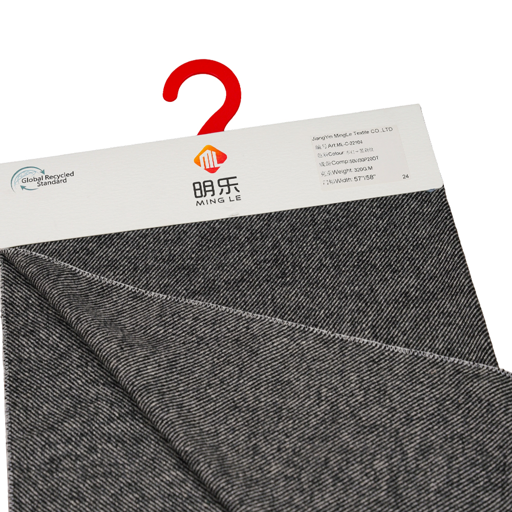 50 % Wolle, 30 % Polyester, 20 % andere Fasern, 320 g/m, gebrochenes Weiß + Schwarz, Twill-Flanellstoff, ML-C-22104